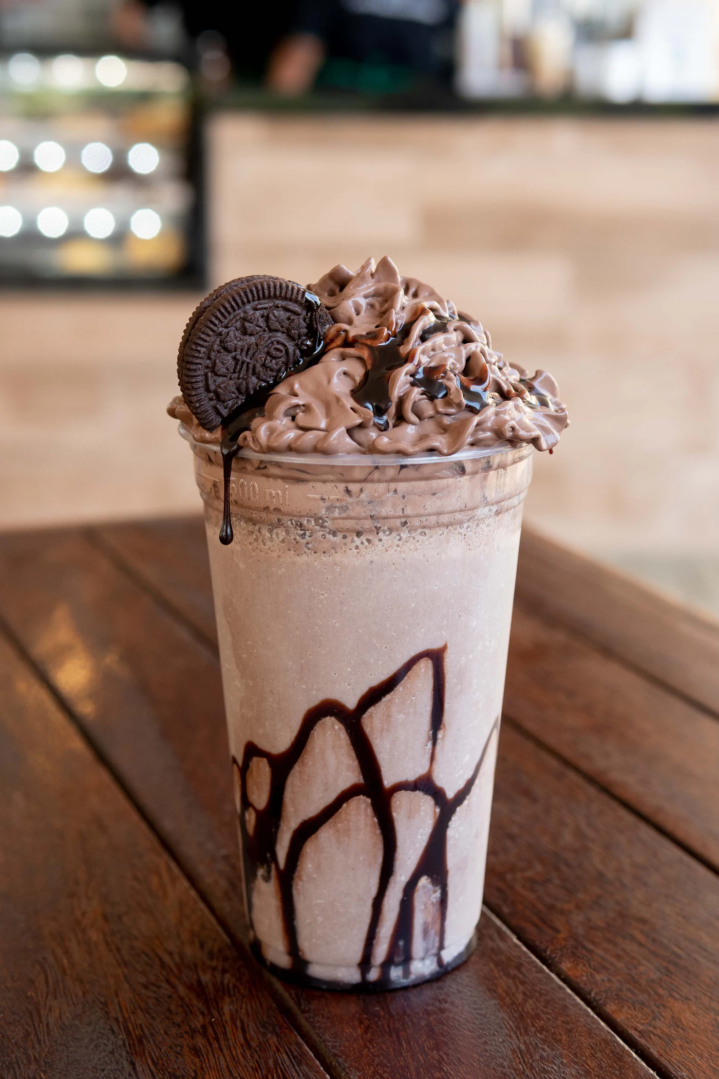Chocolate shake topped with whipped cream and a cookie